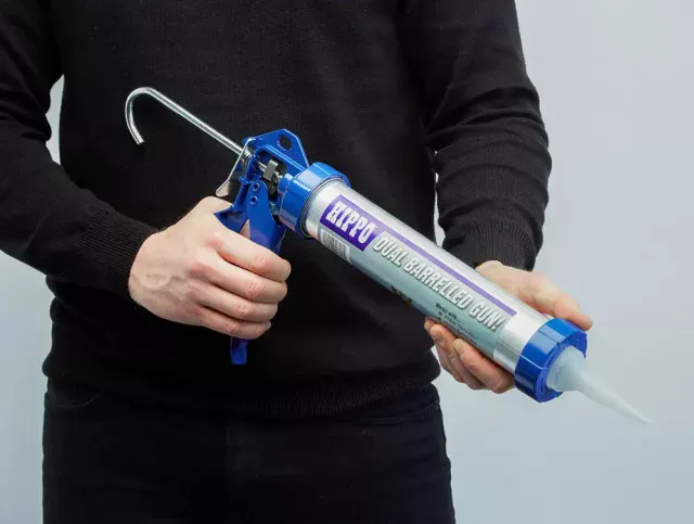 Man holding a Hippo sealant and adhesive applicator gun